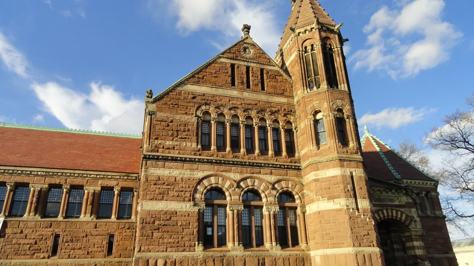 The Winn Memorial Library, a Richardsonian Romanesque brownstone landmark with an arcaded façade and corner tower, Woburn, Massachusetts
